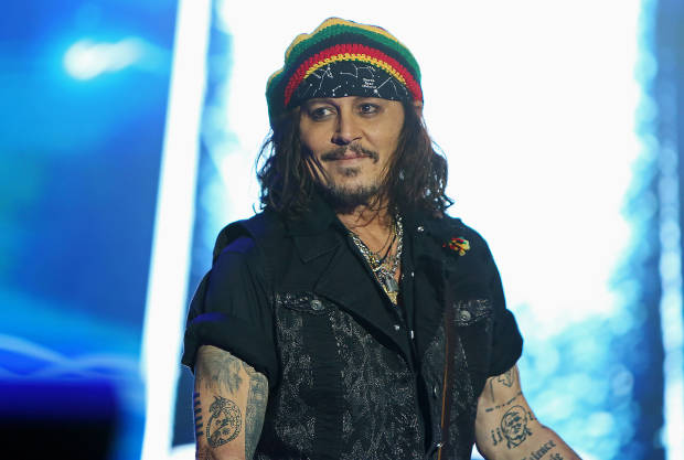 Johnny Depp Spotted Walking With a Cane After Sustaining Injury all-available